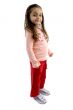cute girl standing with one hand in pocket
