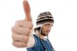 handsome guy wearing woolen cap with thumbs up