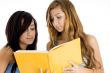 classmate looking in book