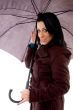 smiling woman holding umbrella on white background