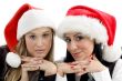 young colleagues wearing christmas hat