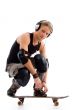 male listening to music on skate board