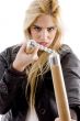 front view of aggressive female holding nunchaku