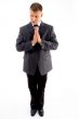 praying executive looking sideways