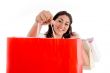 portrait of woman showing shopping bags