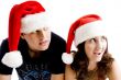 portrait of young couple wearing christmas hat
