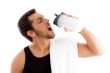man drinking while exercising