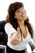 smiling female executive with thumbs up
