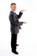 side pose of standing measuring businessman