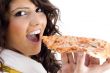pretty woman eating delicious pizza