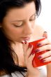 woman holding coffee mug against white background