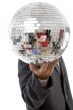 young guy hidden his face with disco ball