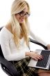 smiling businesswoman working on laptop