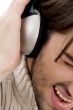 male enjoying music on headphone