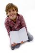 front view of boy sitting and reading book
