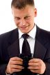 young executive holding binoculars smiling