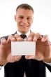 smiling executive holding business card