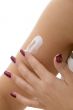 female applying lotion on hand