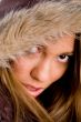close up of young female wearing winter coat