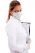 medical professional with writing pad and mask