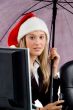 professional woman wearing christmas hat