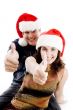 people with christmas hat showing thumbs up