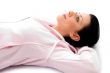 side view of laying woman looking upward