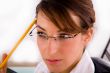 thinking service provider holding a pencil