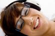 close up of smiling woman listening to music
