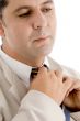 professional man adjusting his tie