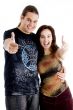 pointing couple looking at camera