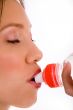 close up of woman drinking water