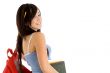 side view of college girl with bag and books