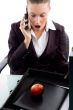 shocked professional talking on mobile