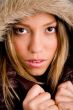 portrait of young woman holding her winter coat