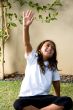 young boy raising his arms