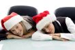 young colleagues wearing christmas hat