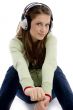 sitting female listening track on headphone