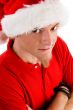 male wearing christmas hat looking at camera