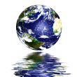 planet earth reflected on top of water