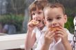 Sister and Brother Eating an Apple