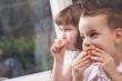 Sister and Brother Eating an Apple