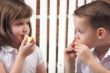 Sister and Brother Eating an Apple