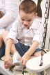 Adorable Young Boy Getting Socks On
