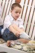 Adorable Young Boy Getting Socks On