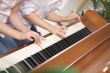 Children Playing the Piano