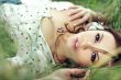 girl lying down of grass