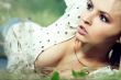 girl lying down of grass
