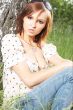 girl lying down of grass