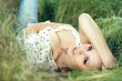 girl lying down of grass